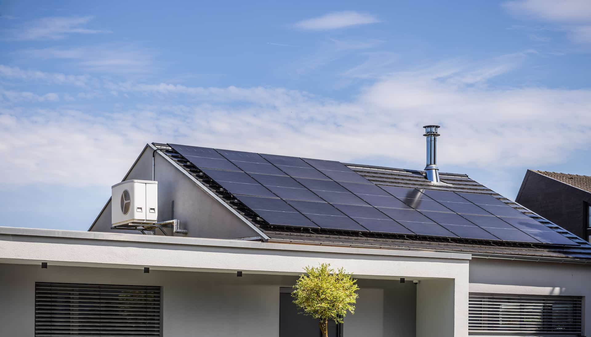House roof covered in solar panels showing how much roof space do you need for solar panels